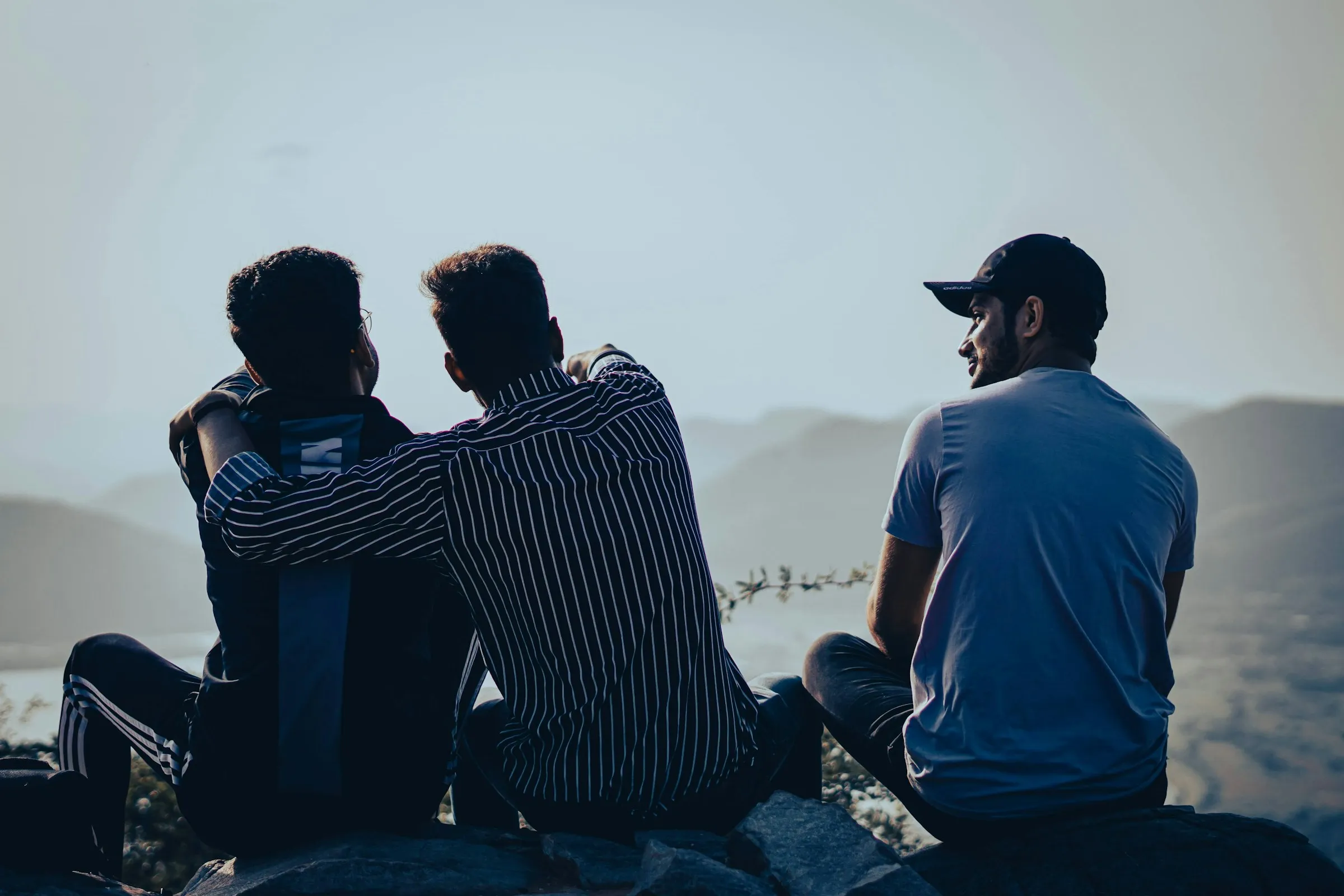 Men gathered on a hillside