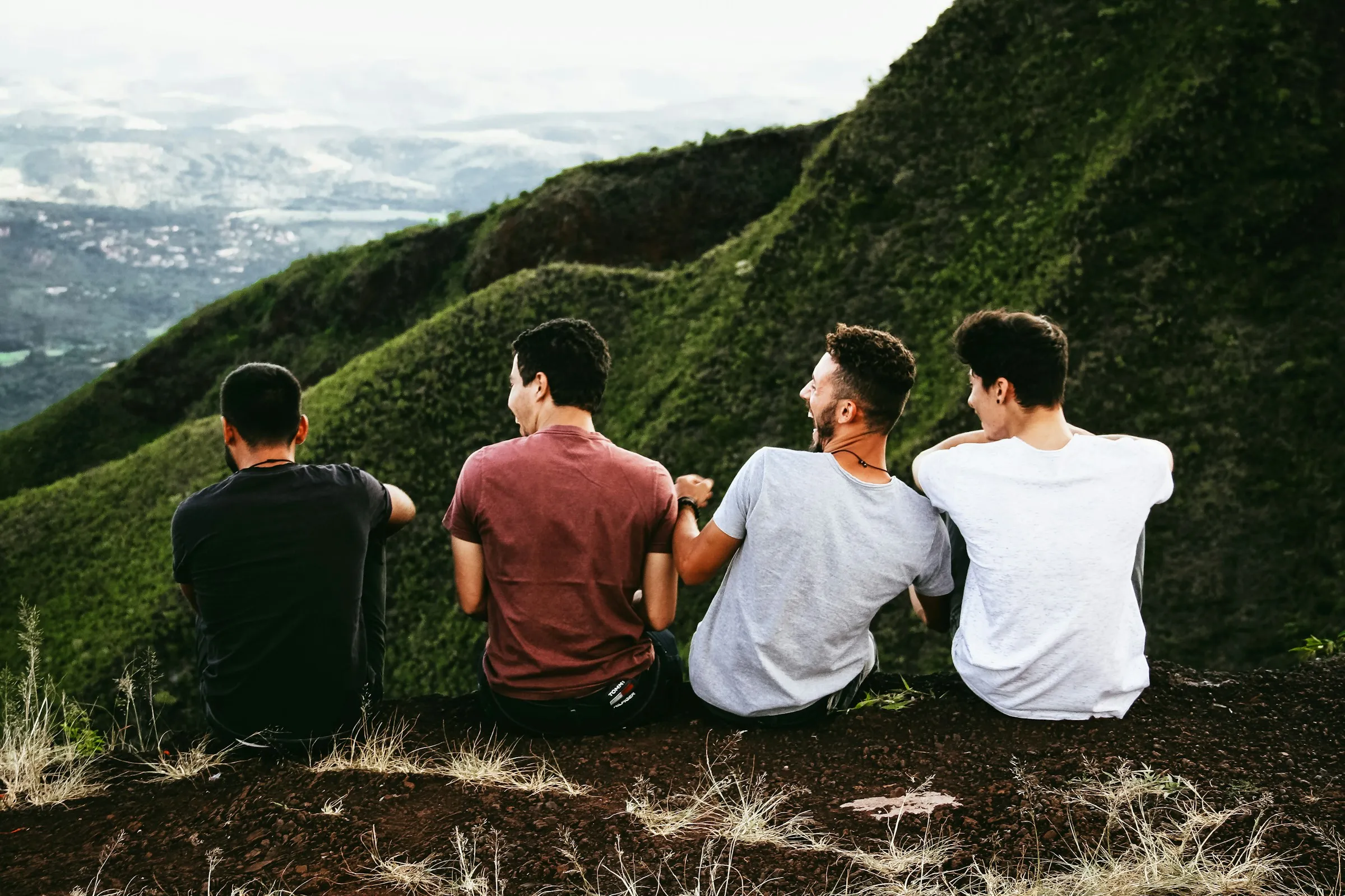 Men sitting together outdoors